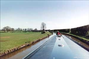 Narrowboat. Looking back along the narrowboat toward the stern. 