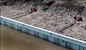 Narrowboat. British Waterways were dredging the canal and reinforcing the bank.