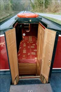 Narrowboat. Looking forward from the tiller position.