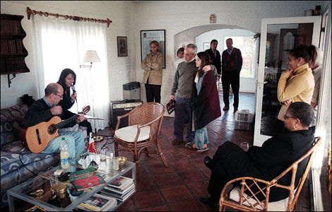 Clockwise from left: Jose Luis Zapata, Monica Zapata, Susana Ferrecio, Adriana Picot (partially hidden), Juan Sicardi with arm over shoulder of Pilar Seeber, Ricardo Seeber (in background) with Jose Luis Ferrecio, Sharon Douglas, Paula Dowers (partially hidden in doorway), Joyce Hartsfield (sitting)