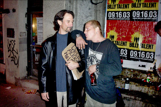Willie collects cardboard signs inscribed by the homeless and other unfortunates.