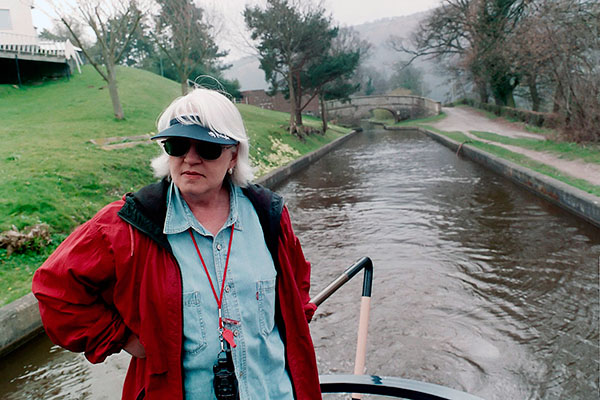 Narrowboat. Paula at tiller
