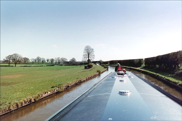 Narrowboat. Looking back along the narrowboat toward the stern. 