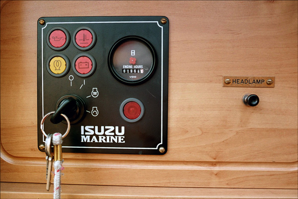 Narrowboat. Just inside the boat, the engine ignition switch and warning light