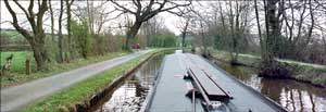 Narrowboat. Paula walks ahead.