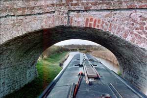 Narrowboat. Line a 54 foot boat up to glide smoothly through a narrow opening without bumping or scraping the sides of the boat.