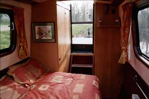 Narrowboat. Looking aft from the bedroom. Wardrobe on the left.